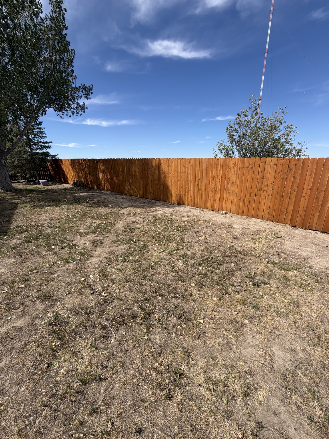 Finished wood privacy fence built by Cutbow Construction in Wyoming
